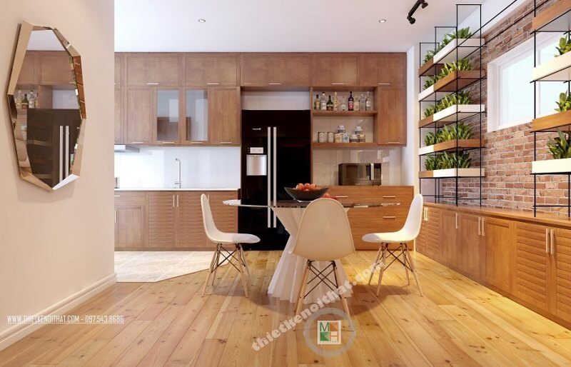 Mẫu thiết kế phòng ăn chung cư đẹp với bộ bàn ăn đơn giản nhỏ gọn kết hợp với tủ bếp gỗ công nghiệp cao cấp sẽ tạo nên không gian phòng ăn lý tưởng.